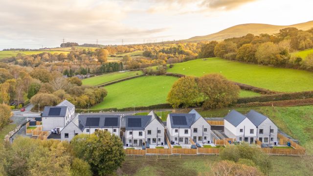 Picture of the new homes with open countryside in the background. 